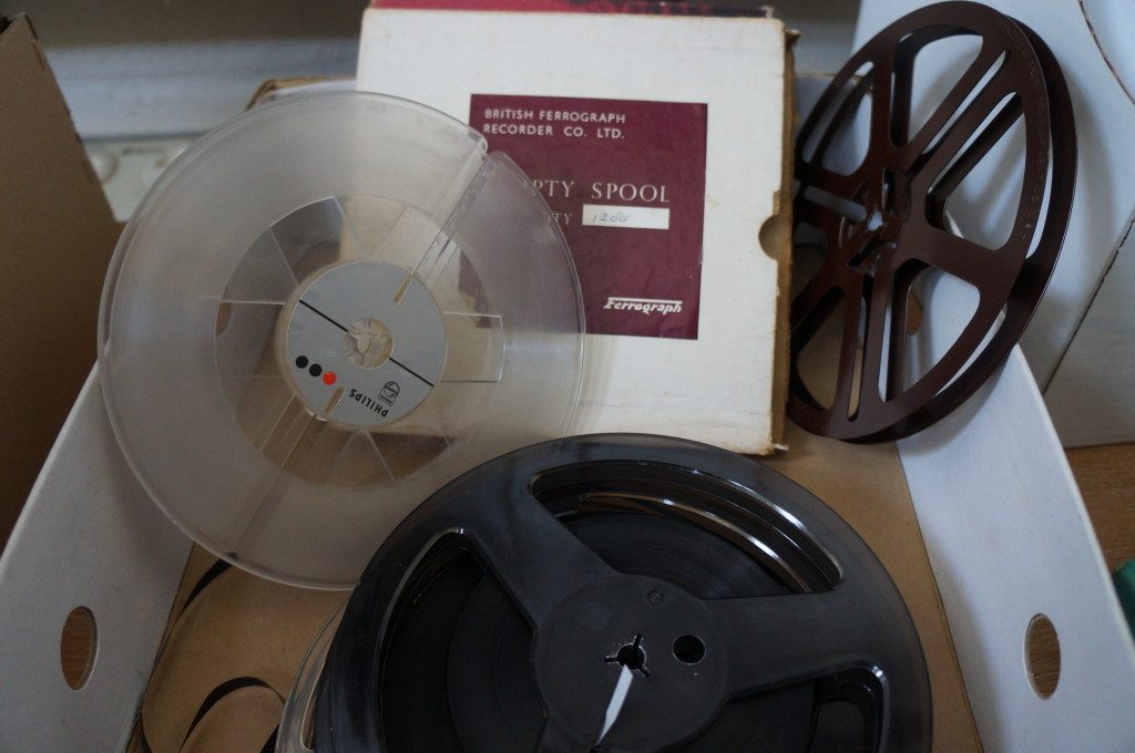 Two reel to reel plastic spools and tape box