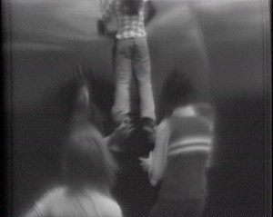 Young people sliding down the side of an inflatable structure - Action Space archive