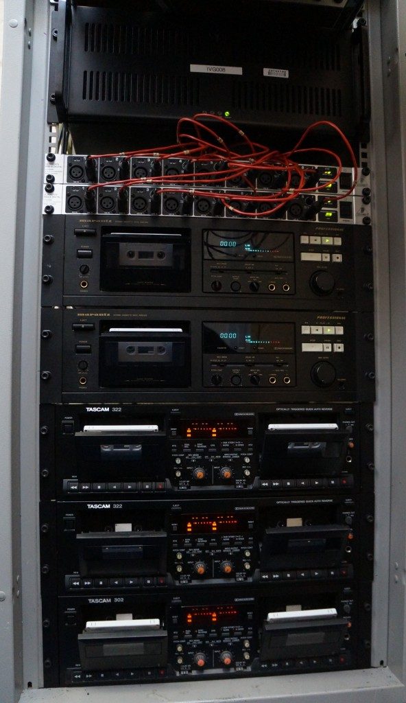 Stack of professional tape machines, including Marantz PMD 502 and Tascam 322