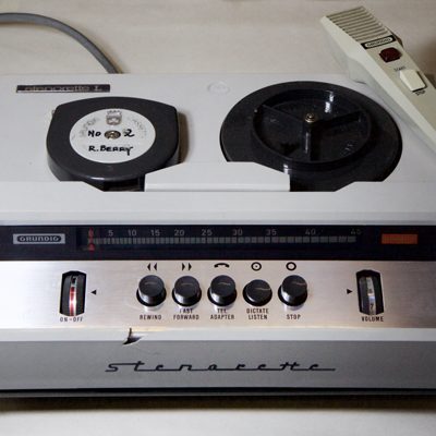 1960s design reel-to-reel style desktop machine with telephone handset-style microphone