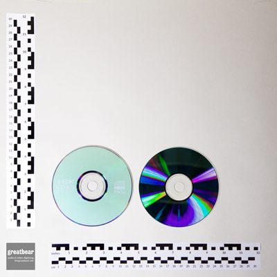 2 compact discs with rulers indicating diameter (each) of 4 ¾ inch / 120 mm
