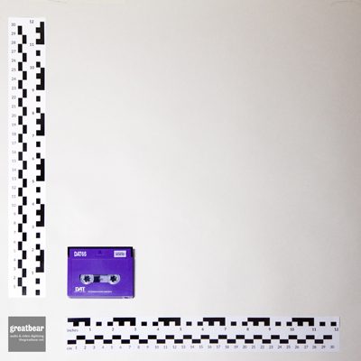 bright purple rectangular DAT cassette, with rulers showing dimensions 7.3 cm × 5.4 cm