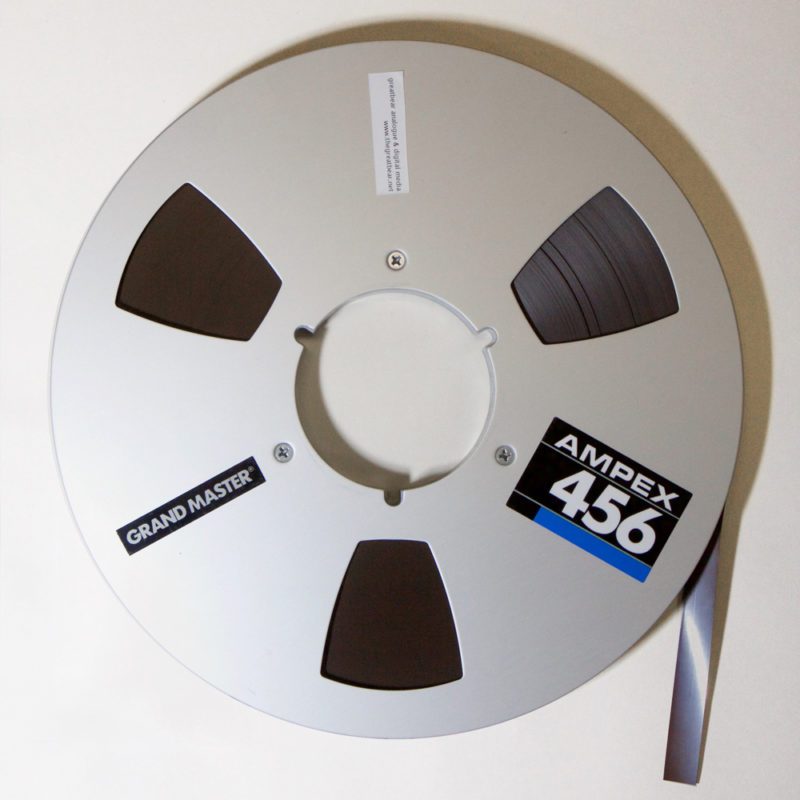 Aluminium Ampex spool with half inch brown magnetic tape