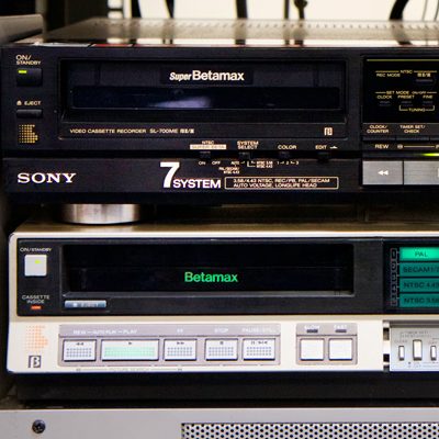 2 rack-based Sony Betamax machines, the upper one labelled 7 system, the lower one with PAL button lit up