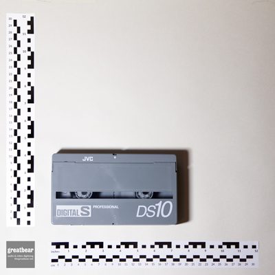 light grey Digital S / D-9 cassette with rulers indicating width 18.8 cm by height 10.3 cm.